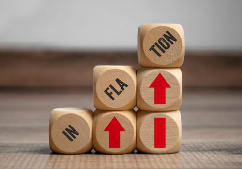 Cubes,,Dice,Or,Blocks,With,Inflation,On,Wooden,Background